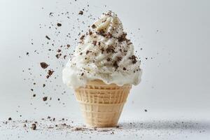 Ice cream cone with chocolate and sprinkles photo