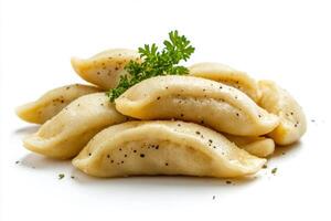 A pile of dumplings on a white surface photo