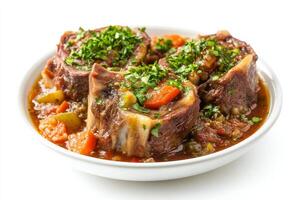 A bowl of meat and vegetables with a spoon photo
