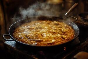 A pan with food cooking on top of a stove photo