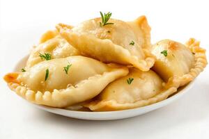 A bowl of dumplings with herbs on a white background photo