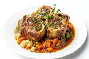 A plate of meat and vegetables with gravy photo