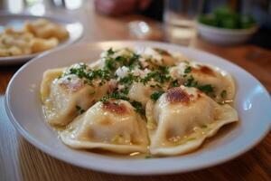 A plate of dumplings with parsley on top photo