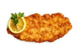 A piece of fried chicken with a lemon wedge photo