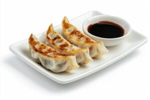 A plate with dumplings and sauce photo