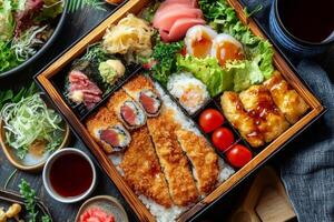 Japanese food in a wooden box with chopsticks photo