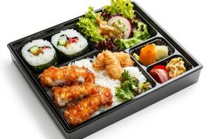 Japanese bento box lunch box with sushi, vegetables and rice photo