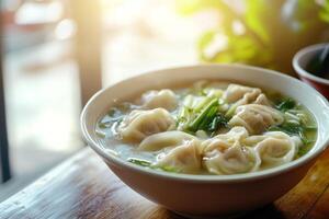 A bowl of soup with dumplings in it photo