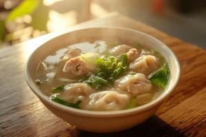 A bowl of soup with meat and vegetables photo
