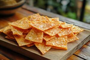 Nachos on a wooden cutting board photo