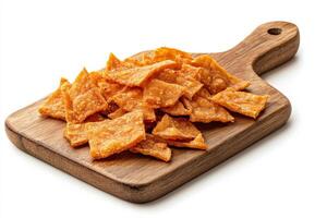 A wooden cutting board with pieces of cheese photo