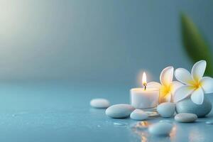 Spa concept with white candle and stones on blue background photo