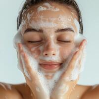 A woman with a face covered in soap photo