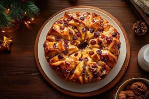 A cake with cherries on top of a wooden table photo
