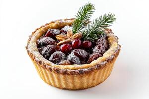 A pastry with cranberries and a sprig of pine photo
