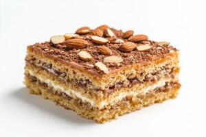A piece of cake with almonds and cream photo