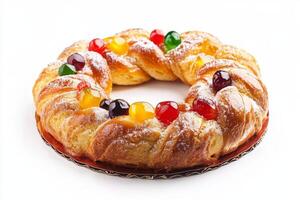 A pastry with fruit and nuts on a white surface photo