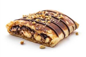 A pastry with chocolate and nuts on top photo