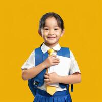 Asian girl in school uniform holding a book and smiling photo