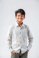 A young boy in a white shirt and khaki pants photo