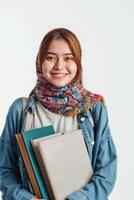 Asian student girl with books and scarf on white background photo
