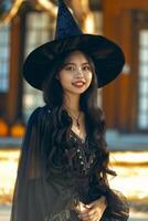A woman in a black witch costume photo