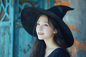A woman wearing a witch hat photo
