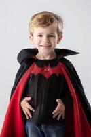 A young boy wearing a bat costume photo