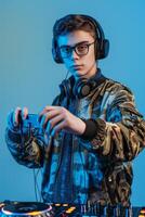 Teenage boy djing at a party photo