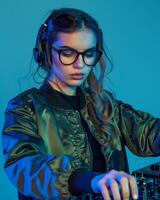 A woman in glasses and a jacket is mixing music photo
