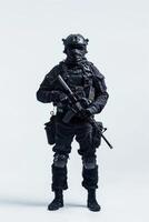A man in a black suit and helmet with a gun photo