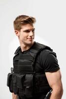 A man in a black shirt and vest holding a gun photo