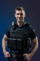 A man in a police uniform posing for the camera photo