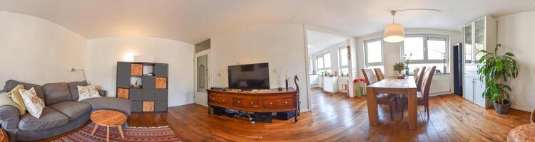 A 360 degree view of a living room with a couch and a tv photo
