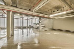 An empty garage with a car parked inside photo