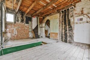 An empty room with exposed brick walls and a pool table photo