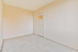 Empty room with a door and a window photo