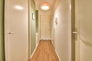 A hallway with a light hanging from the ceiling photo
