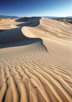 Smooth Rolling Sand Dunes under a Clear Sky photo