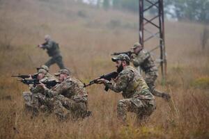 A disciplined and specialized military unit, donned in camouflage, strategically patrolling and maintaining control in a high-stakes environment, showcasing their precision, unity, and readiness for photo