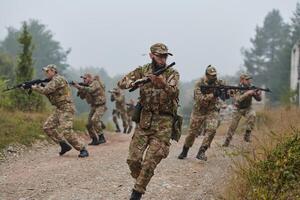 A disciplined and specialized military unit, donned in camouflage, strategically patrolling and maintaining control in a high-stakes environment, showcasing their precision, unity, and readiness for photo