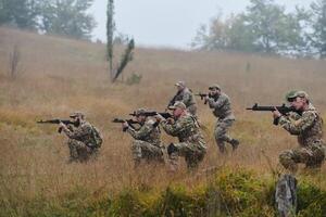 A disciplined and specialized military unit, donned in camouflage, strategically patrolling and maintaining control in a high-stakes environment, showcasing their precision, unity, and readiness for photo