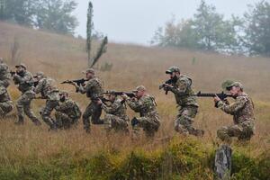 A disciplined and specialized military unit, donned in camouflage, strategically patrolling and maintaining control in a high-stakes environment, showcasing their precision, unity, and readiness for photo