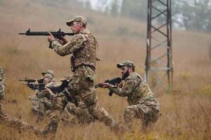 A disciplined and specialized military unit, donned in camouflage, strategically patrolling and maintaining control in a high-stakes environment, showcasing their precision, unity, and readiness for photo