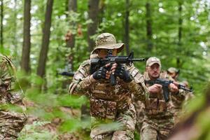 A disciplined and specialized military unit, donned in camouflage, strategically patrolling and maintaining control in a high-stakes environment, showcasing their precision, unity, and readiness for photo