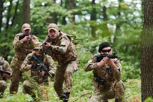 A disciplined and specialized military unit, donned in camouflage, strategically patrolling and maintaining control in a high-stakes environment, showcasing their precision, unity, and readiness for photo