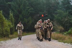 An elite military unit, led by a major, confidently parades through dense forest, showcasing precision, discipline, and readiness for high-risk operations photo