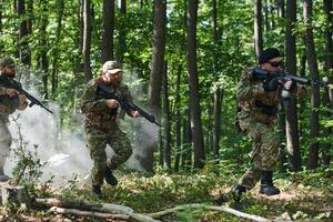 A specialized military antiterrorist unit conducts a covert operation in dense, hazardous woodland, demonstrating precision, discipline, and strategic readiness photo