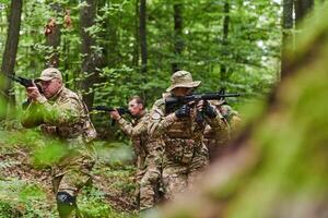 A disciplined and specialized military unit, donned in camouflage, strategically patrolling and maintaining control in a high-stakes environment, showcasing their precision, unity, and readiness for photo