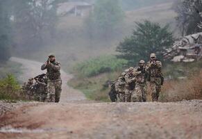 A disciplined and specialized military unit, donned in camouflage, strategically patrolling and maintaining control in a high-stakes environment, showcasing their precision, unity, and readiness for photo